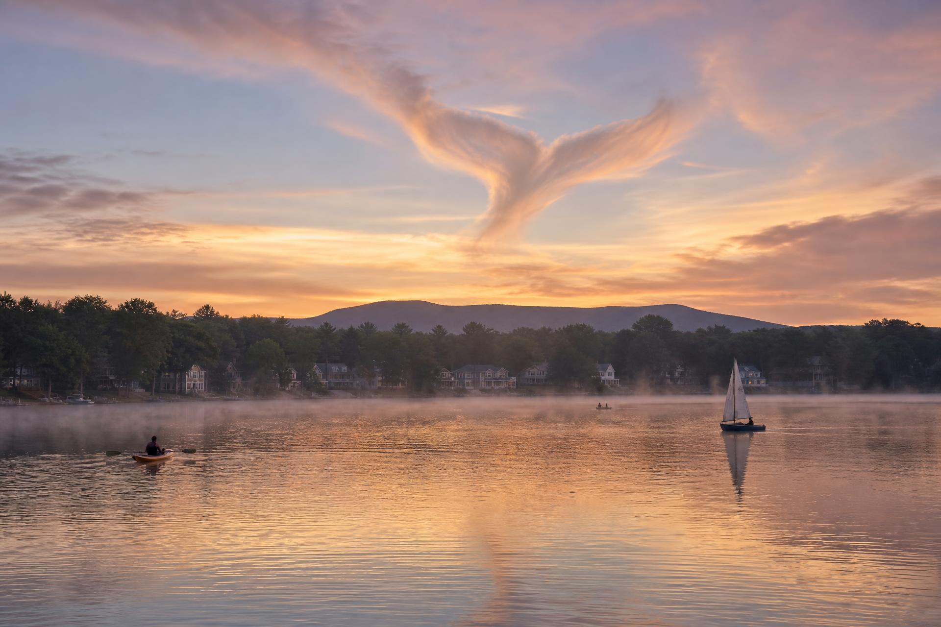 Whale's Tail shaped clouds over Yankee Lake at dawn